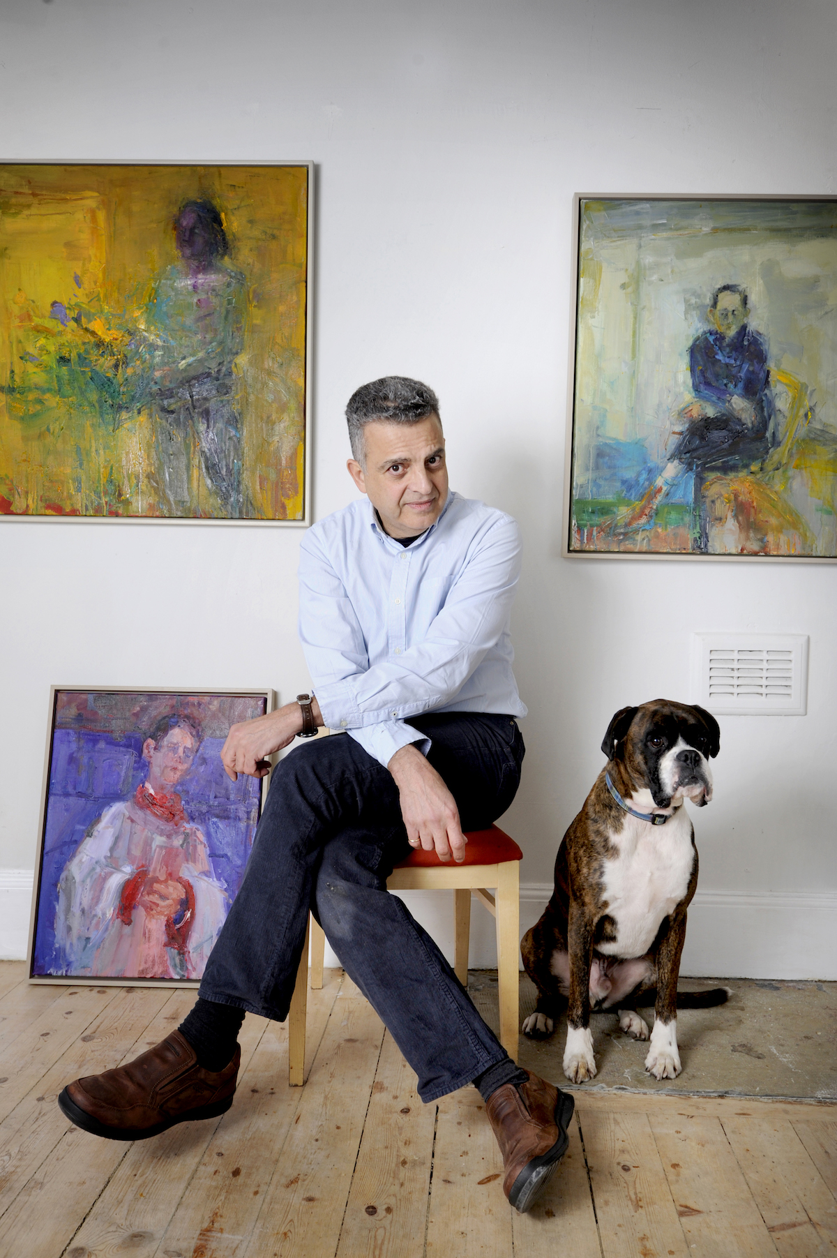 FREE PICTURE: Artist Henry Jabber Exhibition at Union Gallery, Edinburgh, 03/03/2017: Artist Henry Jabbour (correct) at his Union Gallery exhibition of paintings, Edinburgh. Pictured with Dennis the galery mascot / dog, and Henry's paintings including "Seated Man With Dog" (top right). Henry left a successful career as a research scientist to train as a painter is to have his first solo exhibition, opening in Edinburgh’s Union Gallery on Saturday (4th March 2017, and until 1st April 2017). Henry Jabbour, who worked for nearly 20 years based at the Medical School at Edinburgh University, left his job in medical research to train as an artist. Henry, who was born in Lebanon, worked for the Medical Research Council in Edinburgh before quitting to paint full-time in 2010. He said: “For many years, I was working as a scientist and painting every moment I could in my spare time. Bit by bit, my passion for art outgrew my passion for the science. More information from: Susan Mansfield - PR consultant for the Union Gallery - 07803 620 038 - wordsmansfield@gmail.com Photography for Union Gallery from: Colin Hattersley Photography - www.colinhattersley.com - cphattersley@gmail.com - 07974 957 388. Free FIRST USE (ONLY) picture. Photography from: Colin Hattersley Photography - colinhattersley@btinternet.com - www.colinhattersley.com - 07974 957 388